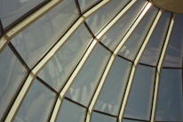 Architectural dome allowing natural light into a spacious living room.