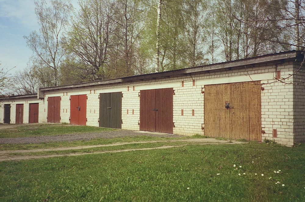 a row of garages with doors on each of them