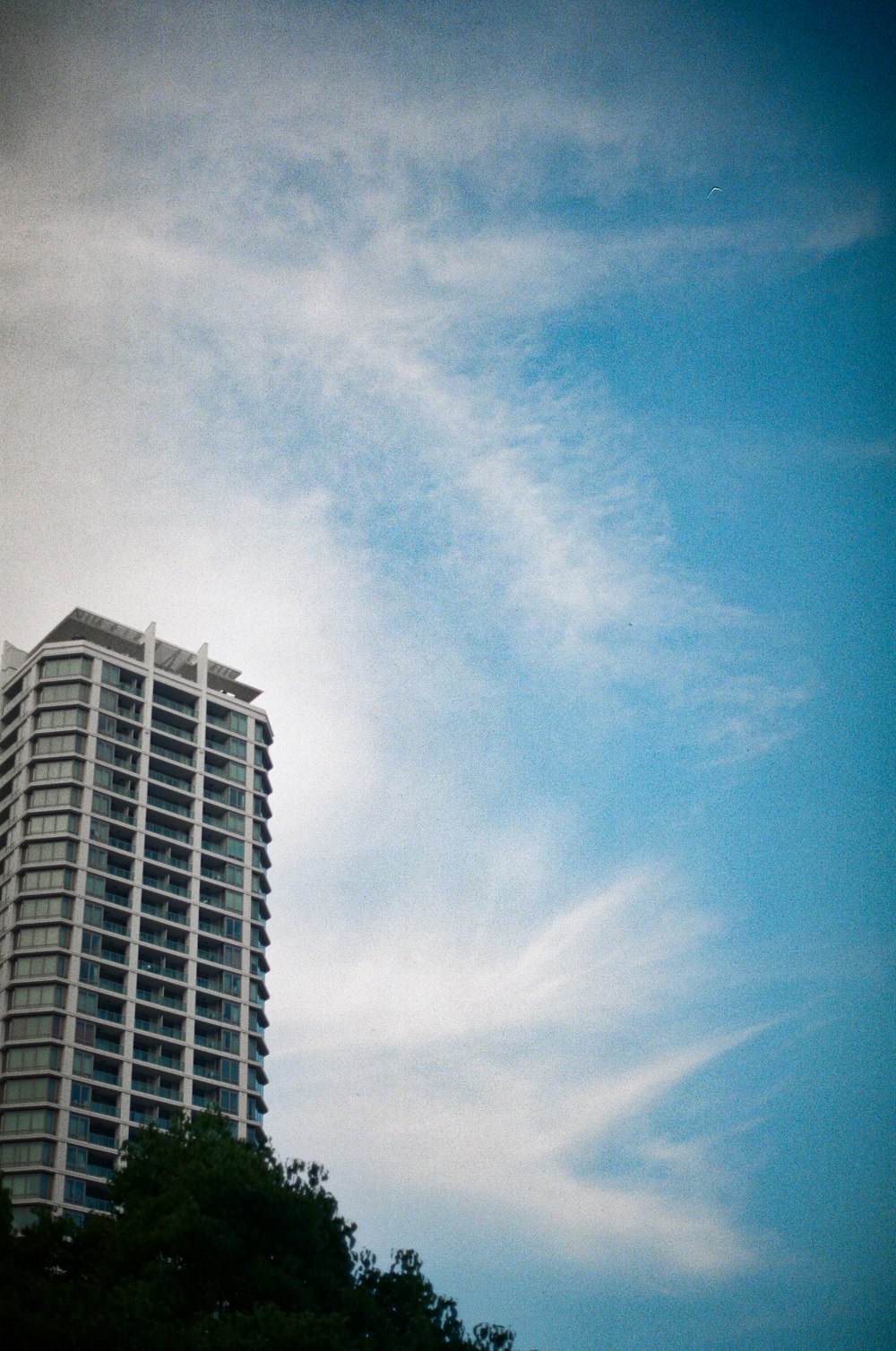 a very tall building with a sky background