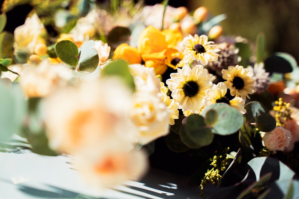 a bunch of flowers that are sitting on a table