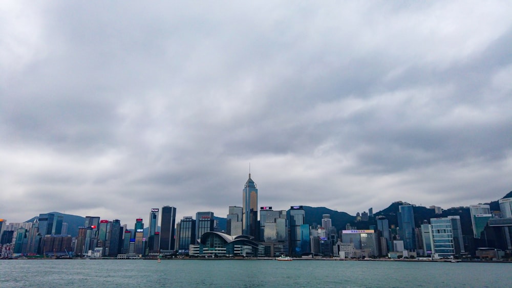 a large body of water with a city in the background