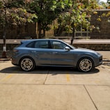 A vibrant SUV parked in an urban setting.