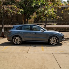 A sleek SUV parked in a scenic tourist location