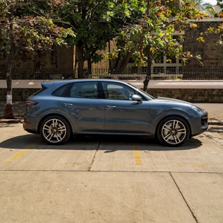 A sleek used SUV parked in a scenic location.