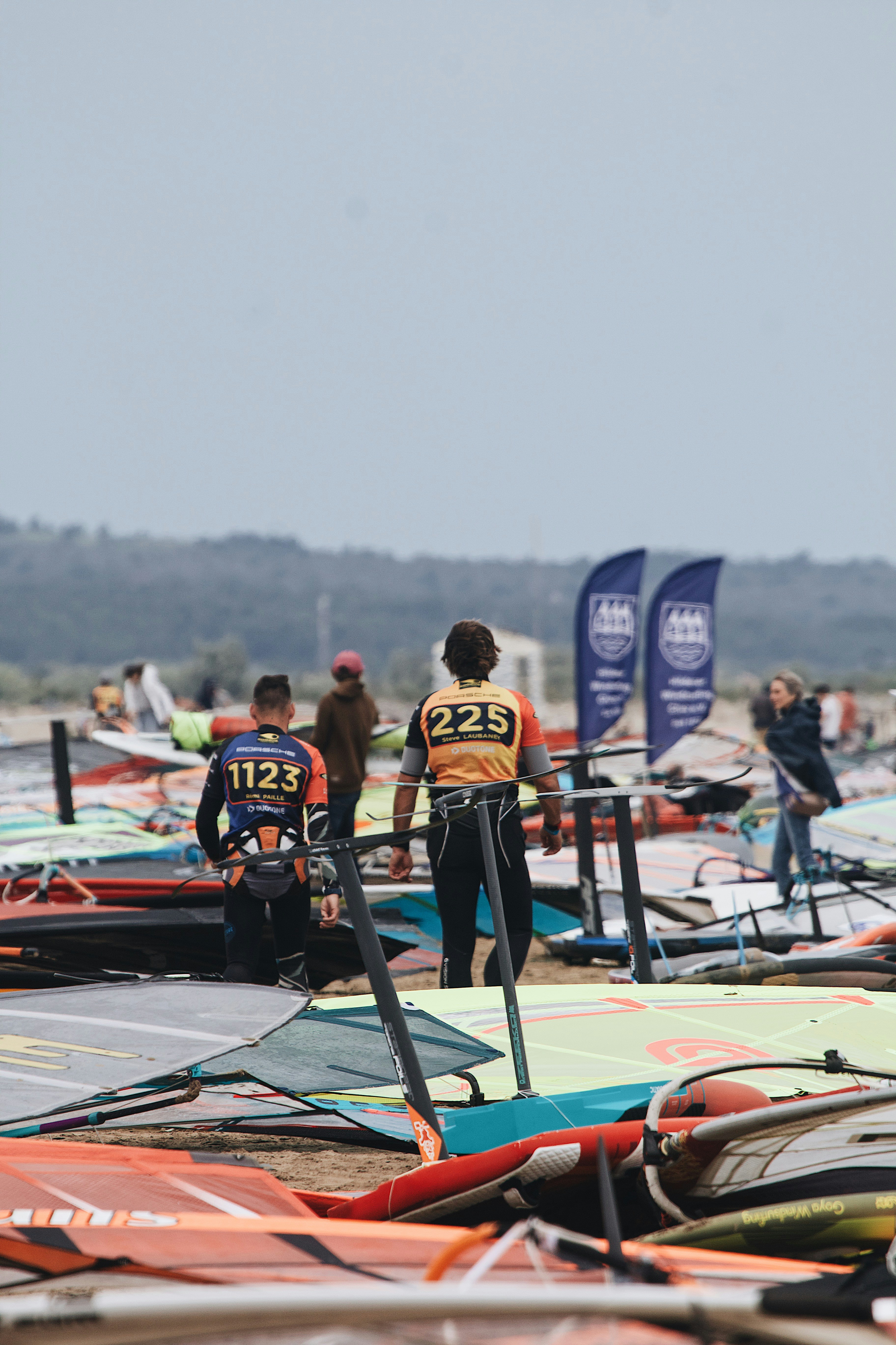 A group of people standing on top of surfboards