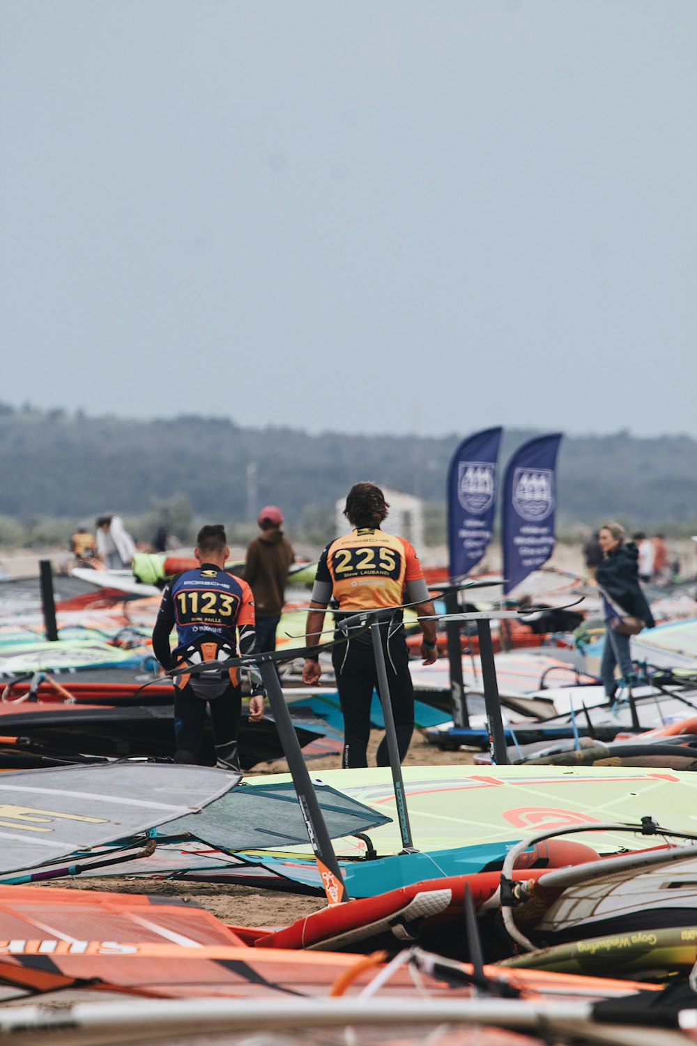 a group of people standing on top of surfboards