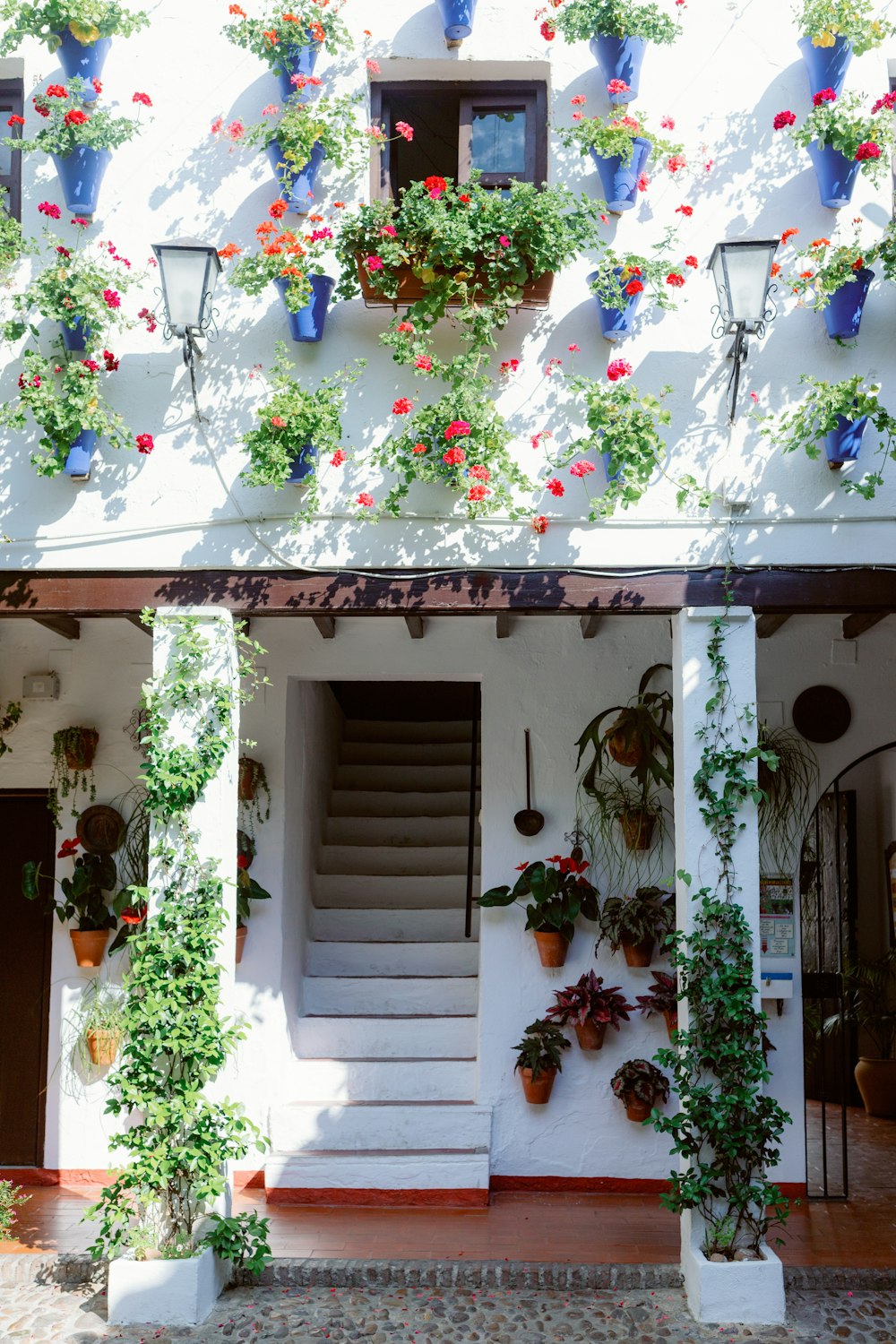 a building with a bunch of flowers growing on it