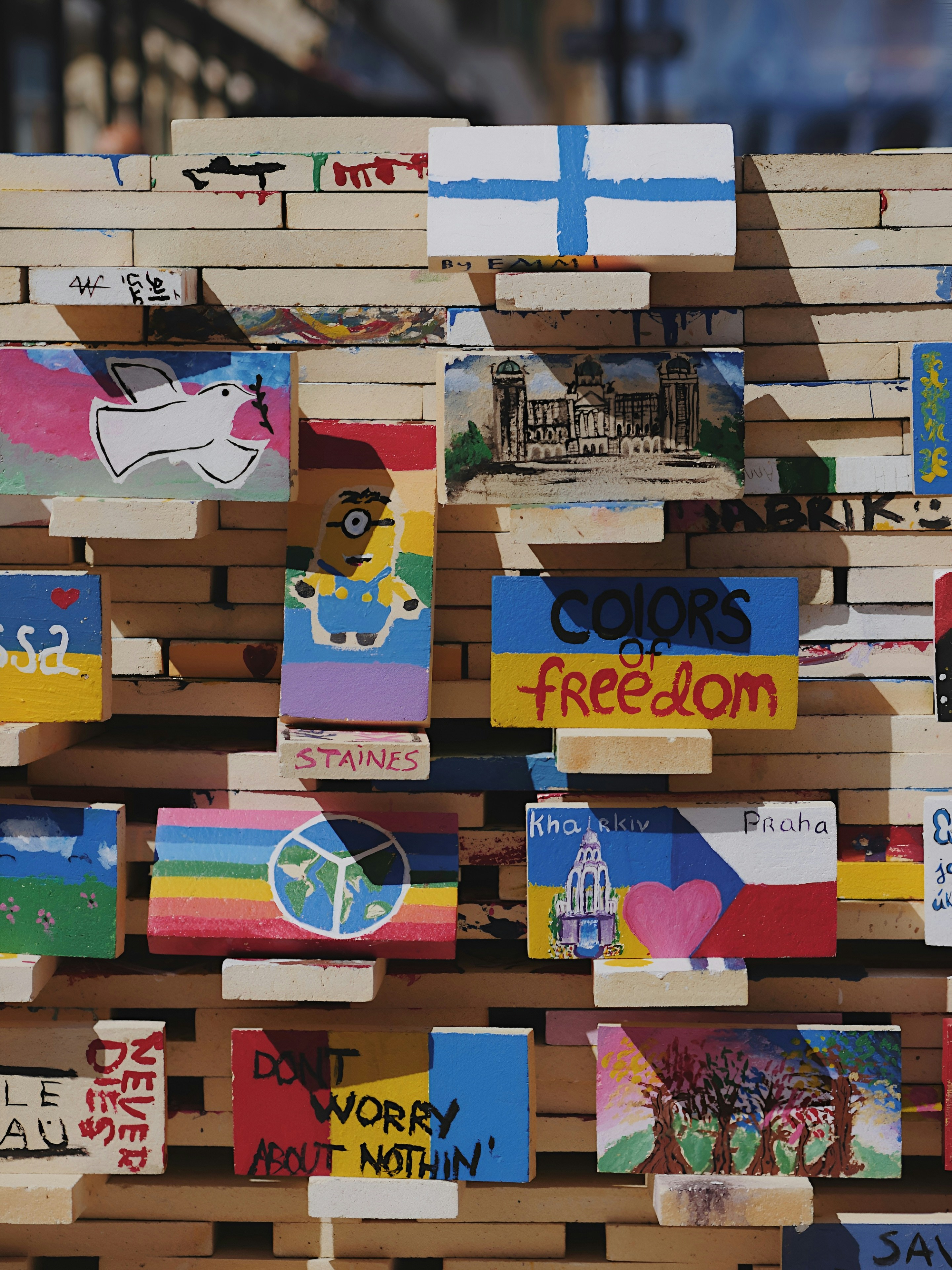 a bunch of wooden signs are stacked on top of each other