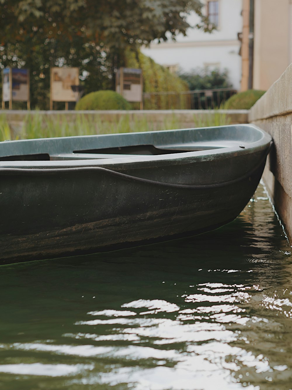 a small boat sitting on top of a body of water