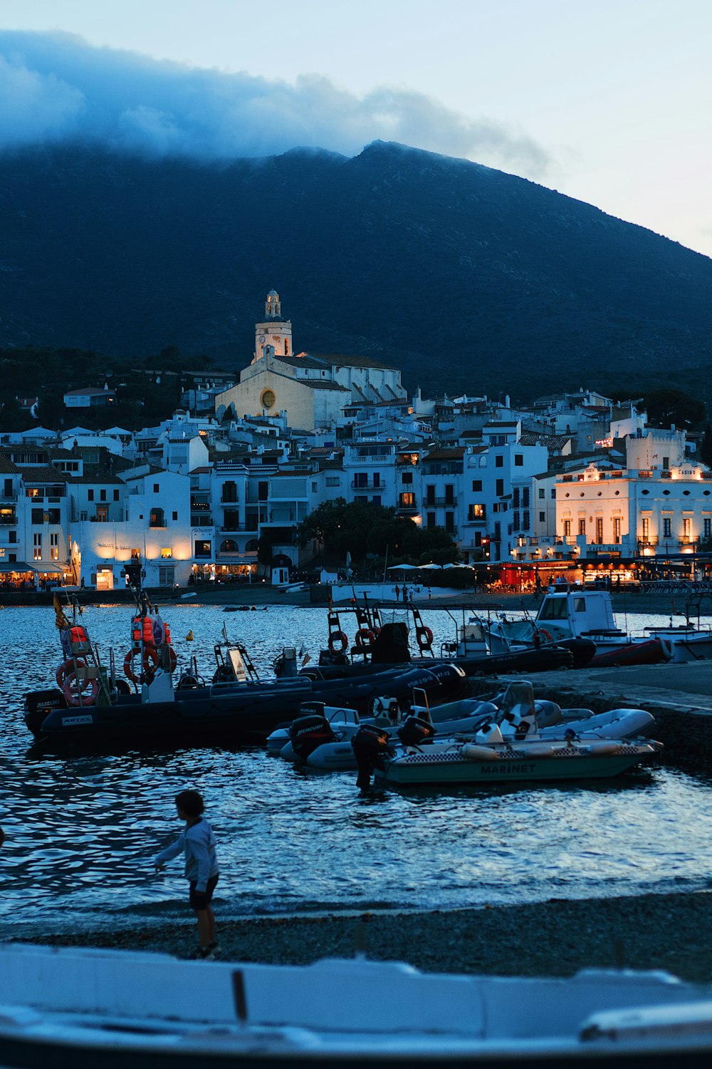 a group of boats sitting on top of a body of water