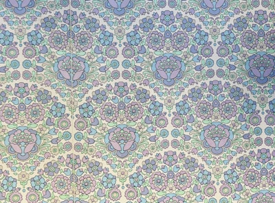 An intricate floral pattern designed for children to fill with colors.