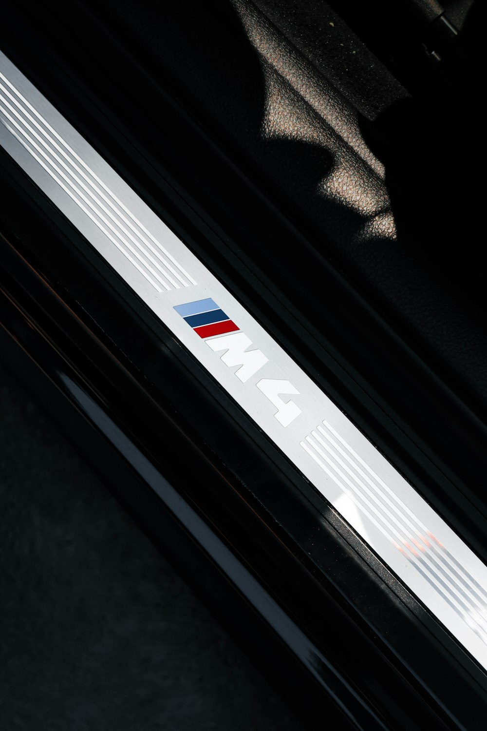 a close up of a bmw logo on a car door