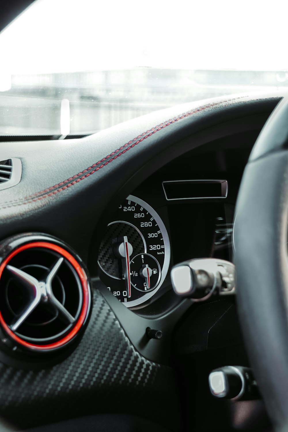 the dashboard of a car with a speedometer and gauges