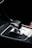 A close-up view of an automatic car gear shift surrounded by a sleek modern console.