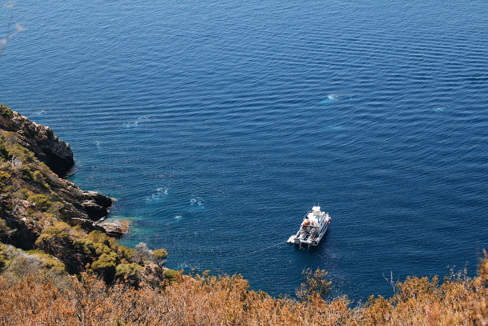 a small boat in a large body of water