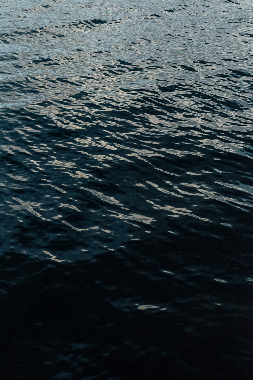 a boat floating on top of a large body of water