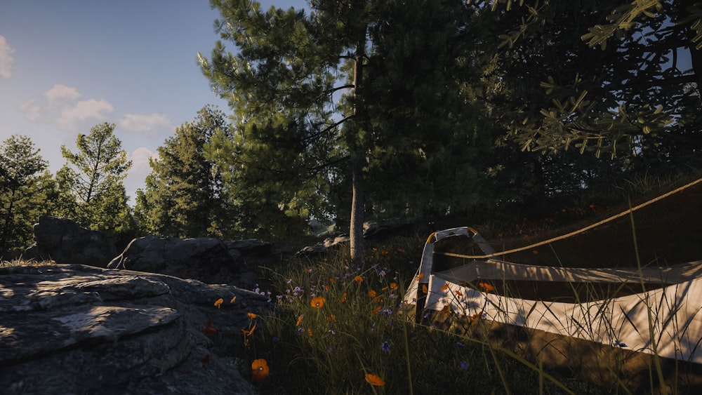 a tent set up on a rock in the woods