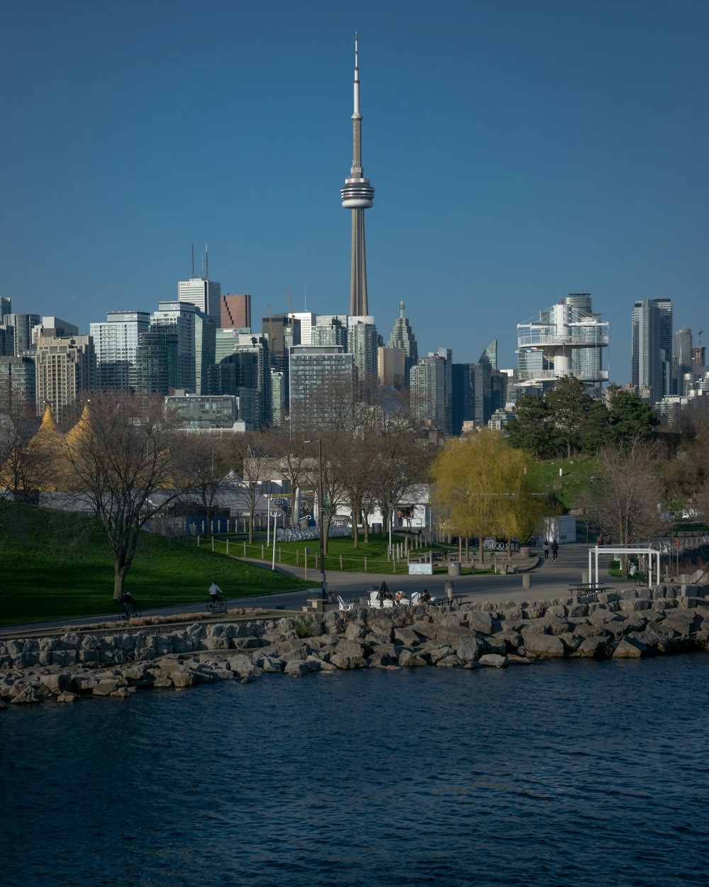 a large body of water with a city in the background