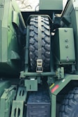 Close-up of secure cargo straps on a transport truck.
