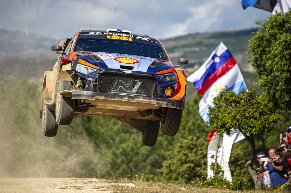 a rally car making a jump in the air