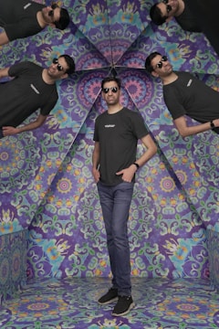 A close-up of a person viewing a digital outfit overlay on their reflection in a dark minimalist room.