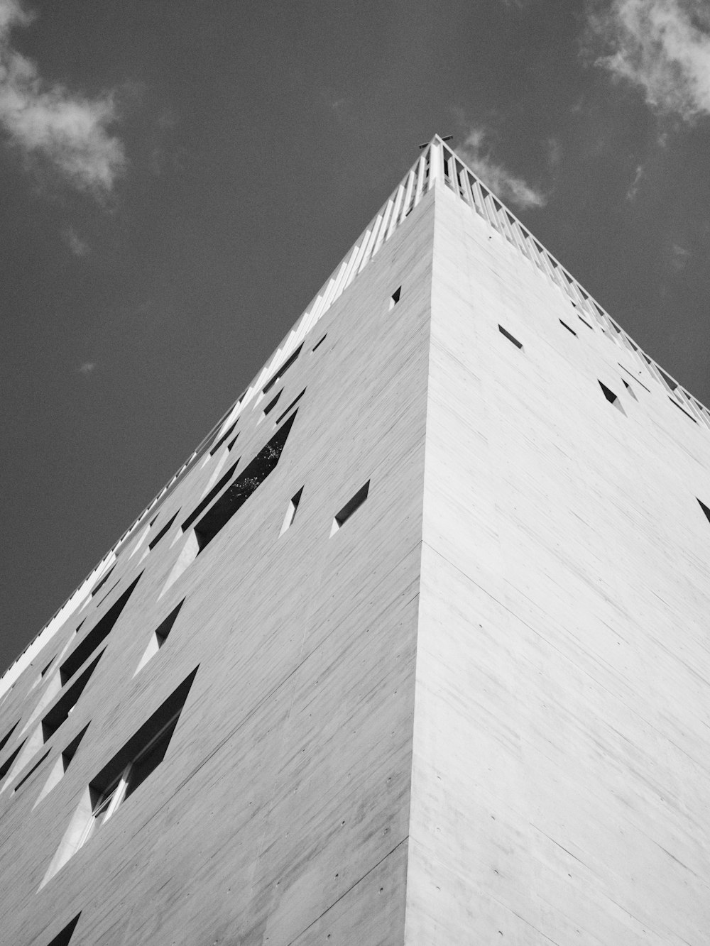 a black and white photo of a tall building