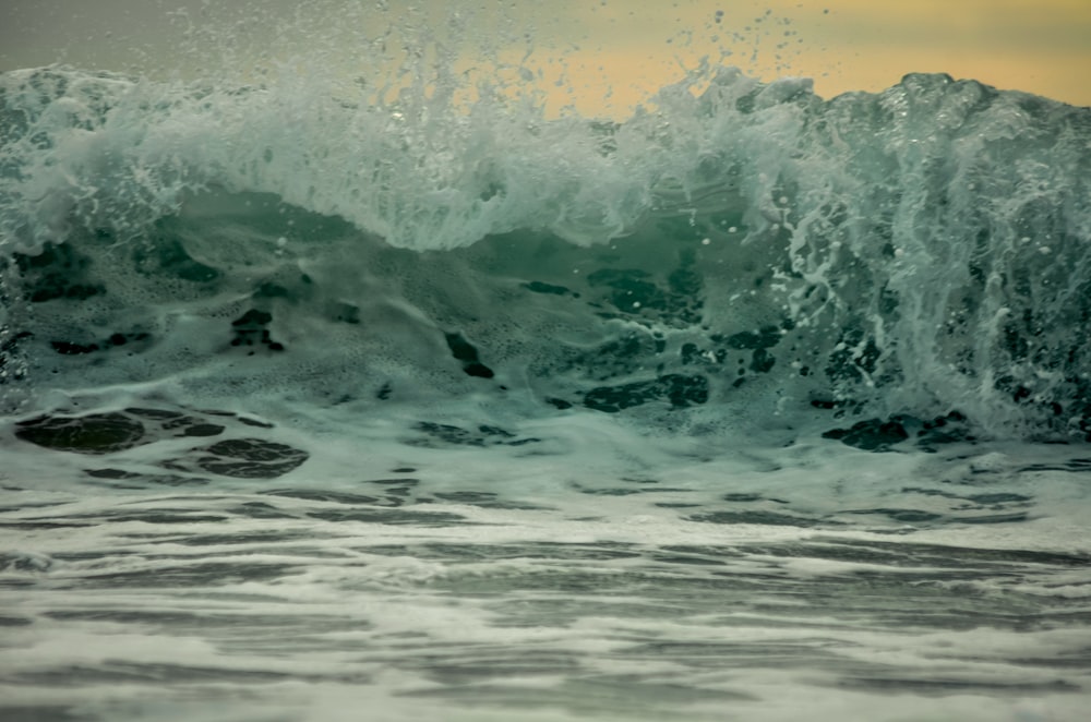 a person riding a surfboard on a wave in the ocean