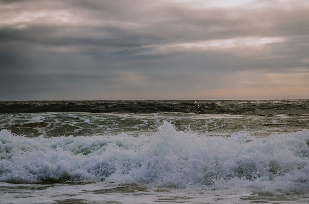 a large body of water with waves coming in to shore