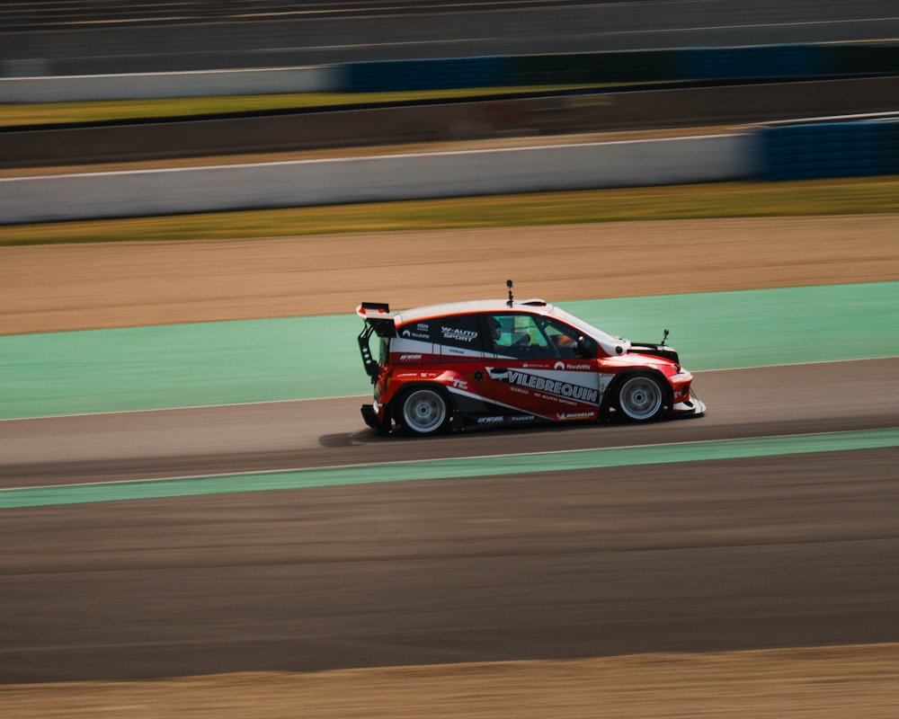 a car driving on a race track during the day