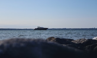 A sleek boat on calm waters, highlighting aadnesen systems' boating services
