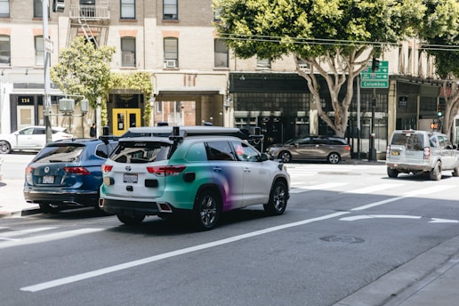 a couple of cars that are sitting in the street