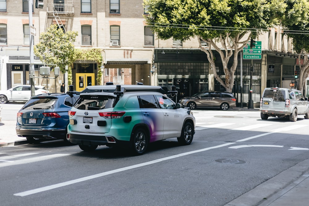 a couple of cars that are sitting in the street