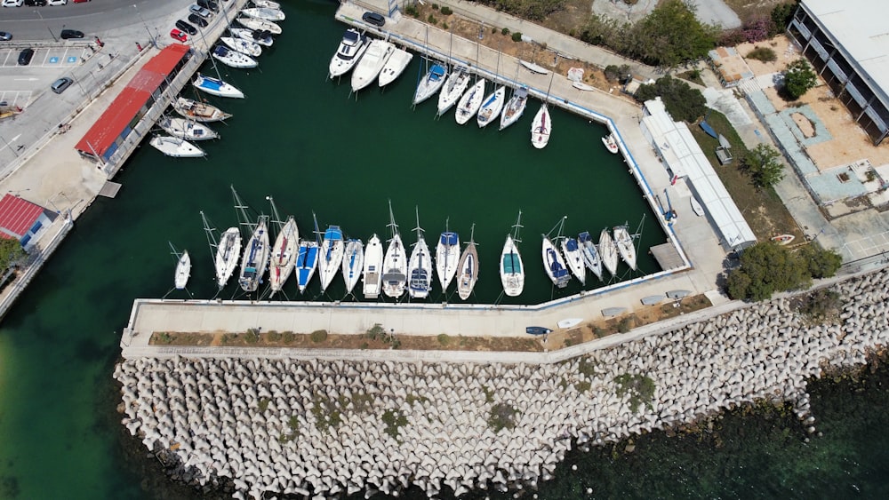 an aerial view of a marina with many boats