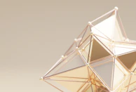 Elegant geometric shapes layered softly, using gold and dark red tones contrasted on light neutral background.