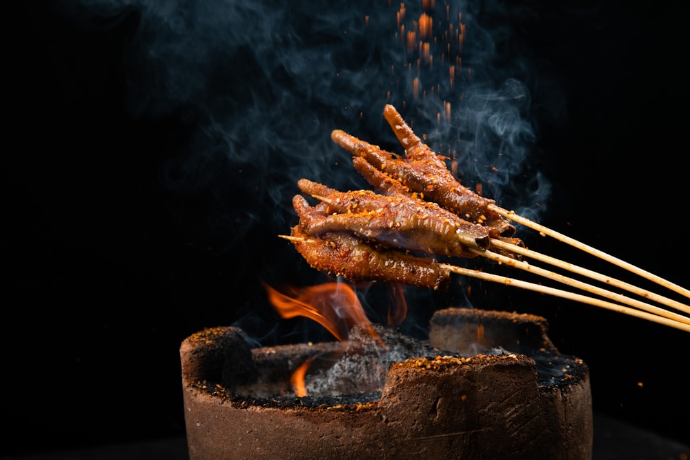 a close up of a bunch of food on a stick