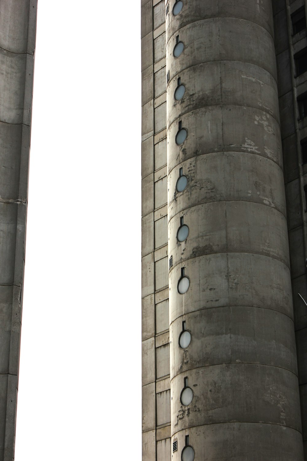 a clock on the side of a tall building