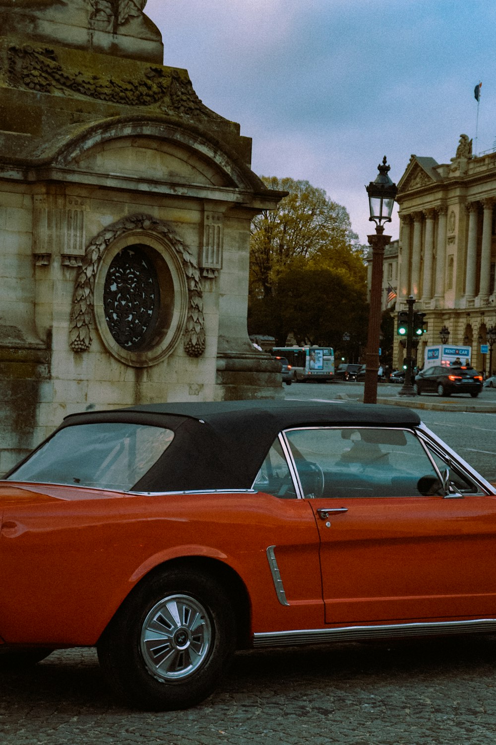 a red car parked on the side of the road