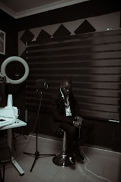 A lawyer discussing contract details with a musician in an office setting.