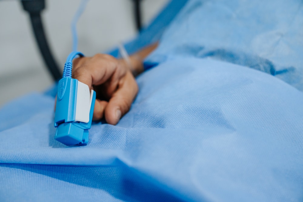 a close up of a person laying in a hospital bed