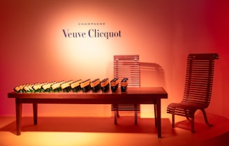 A beautifully arranged display of champagne bottles.