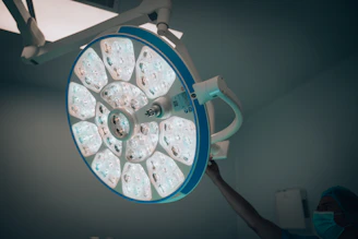 a person operating a medical light in a room