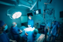 a group of surgeons in a hospital operating room