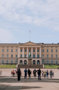 a group of people standing in front of a building