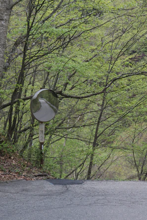 Convex mirrors mounted on a sharp corner to enhance visibility for drivers.