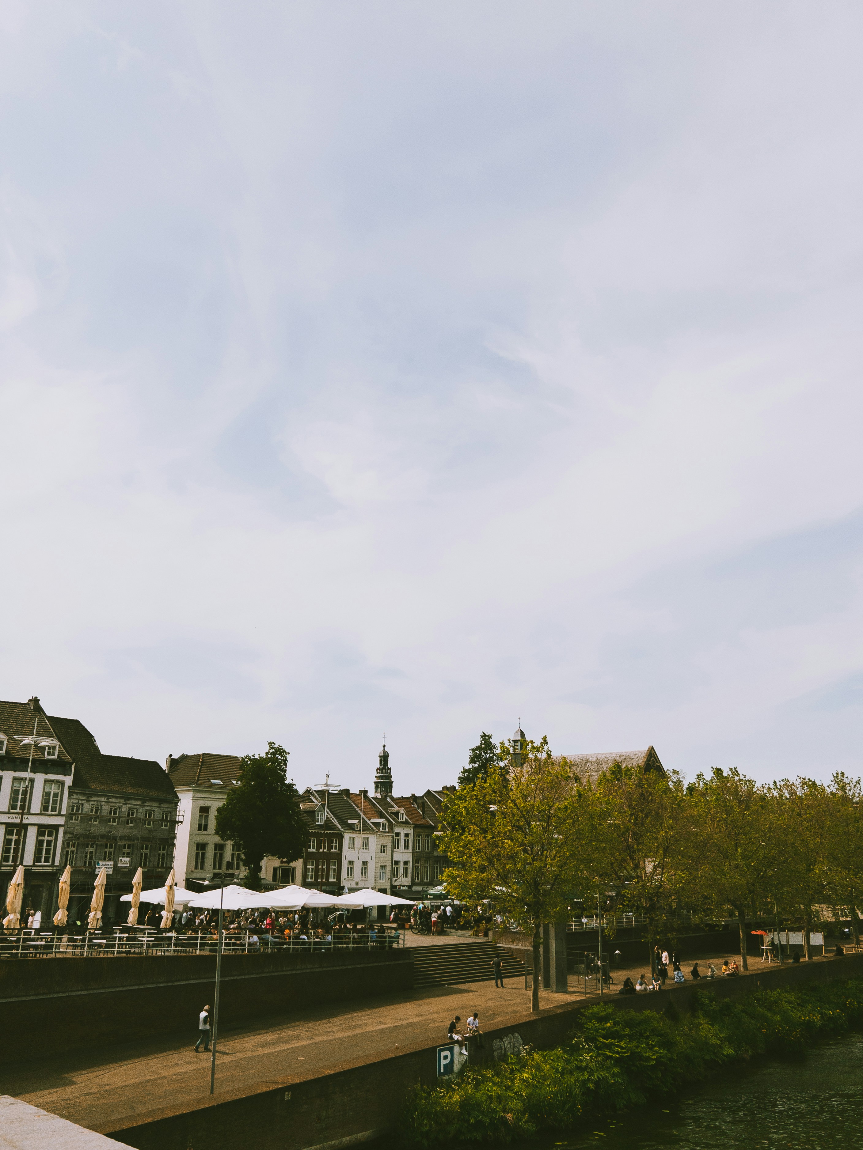 a river running through a city next to tall buildings