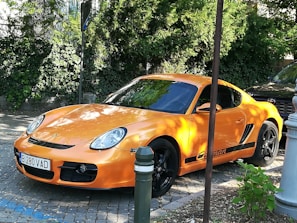 A vibrant sports car parked on a sunny Miami street.