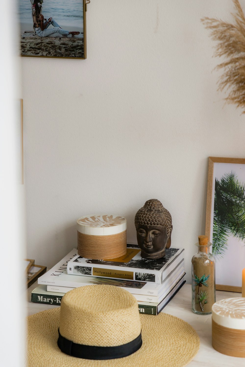 a hat is sitting on top of a stack of books