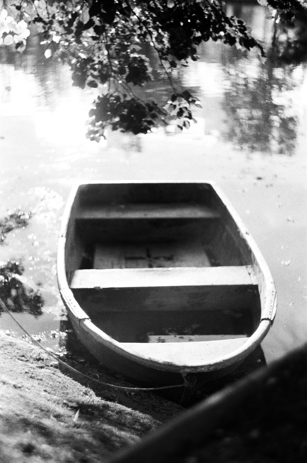 a small boat floating on top of a body of water