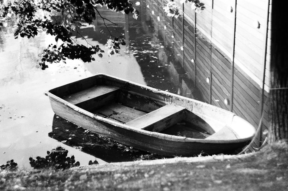 a small boat floating on top of a body of water