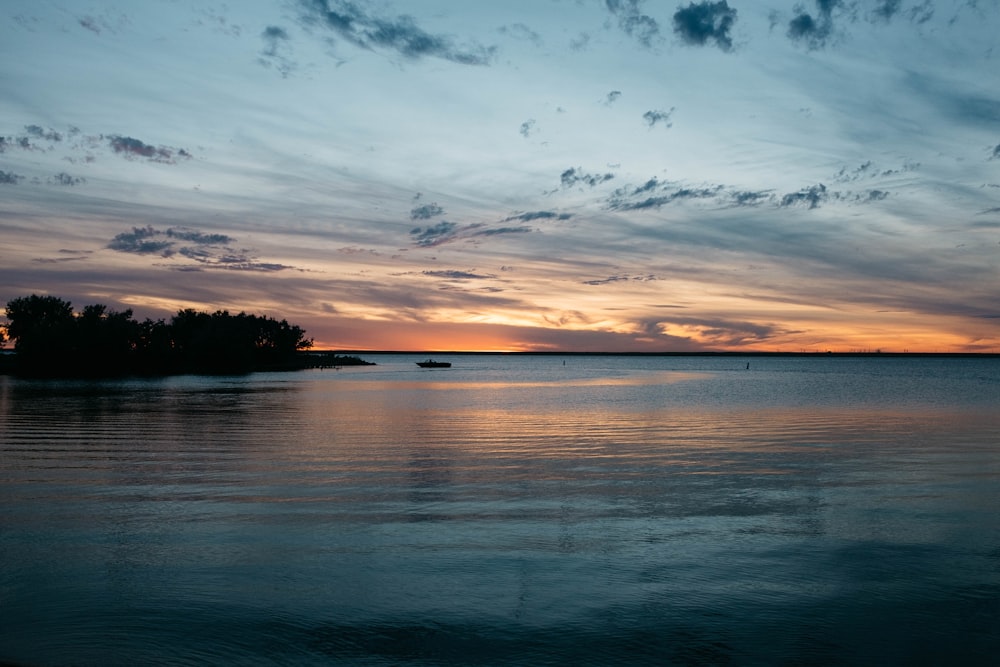 a body of water with a boat in the distance